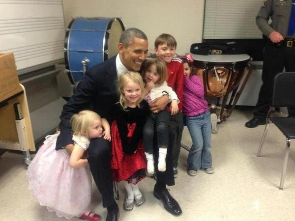 President Obama playing with those who lost their siblings