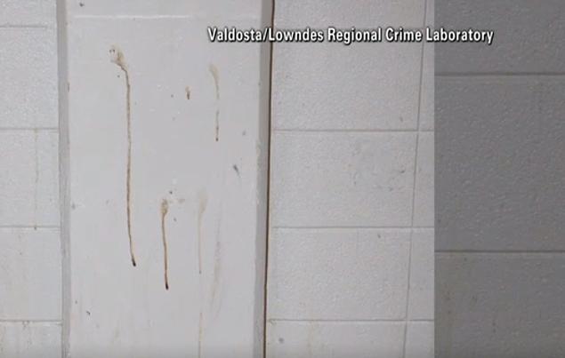 Blood stains on a wall near the mat where Johnson was found. Investigators said the stains were old and that the blood was not Johnson's.