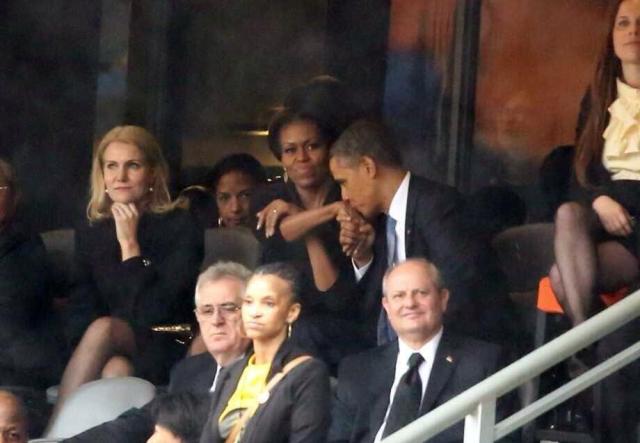 Barack Obama kissing Michelle Hand