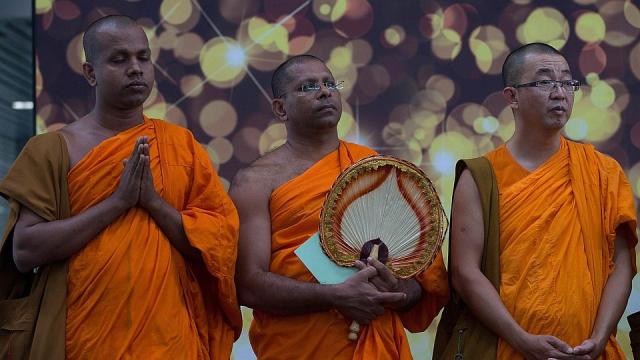Malaysia Airlines-Buddist monks offer special prayers for passengers aboard the missing Malaysia flight MH370 at the Kuala Lumpur International Airport in Sepang on March 9th 2014 Photop AFP
