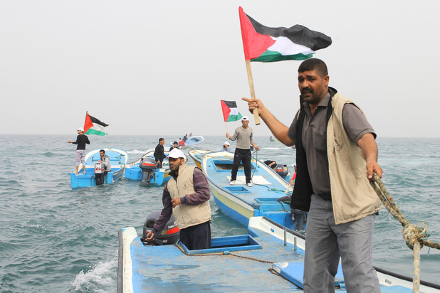 Fisherman and activist Zakaria Baker, right, says that Israel’s crimes in Gaza’s waters are routine.
